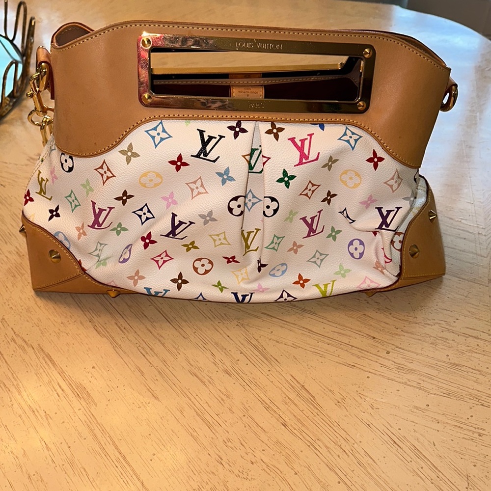 Authentic Louis Vuitton, Judy GM white multicolor in excellent condition.